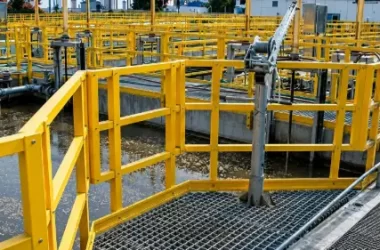 FRP grating platform with yellow safety railings at a chemical processing plant